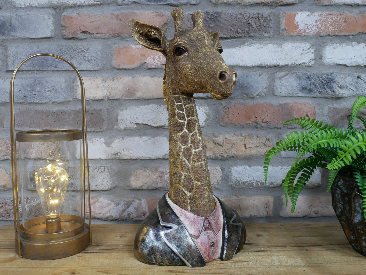 Giraffe bust sculpture displayed on a tabletop