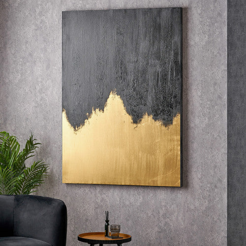 Black and gold textured abstract canvas in a styled interior