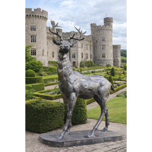 Large standing stag statue looking right