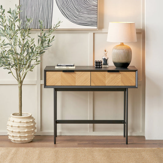 Hailee black and natural chevron console table styled in a contemporary interior