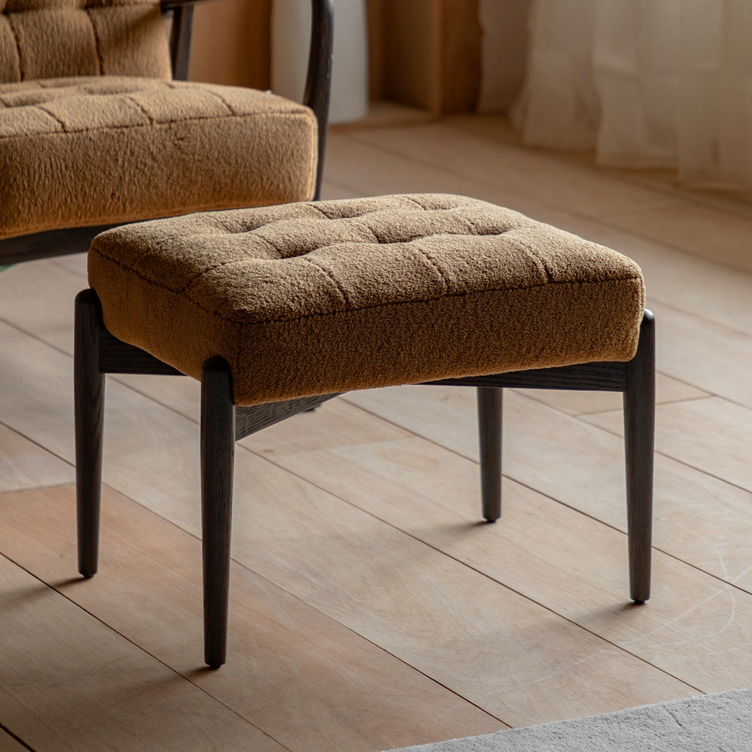 Humber Ochre faux sheepskin footstool in a styled interior