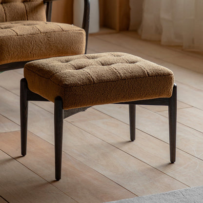 Humber Ochre faux sheepskin footstool in a styled interior