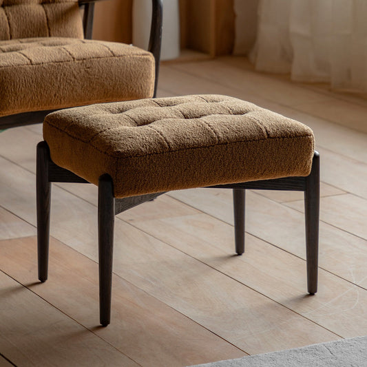 Humber Ochre faux sheepskin footstool in a styled interior