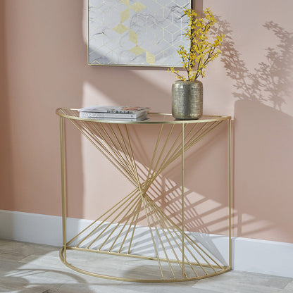 Liberty glass and gold half moon console table styled in an interior