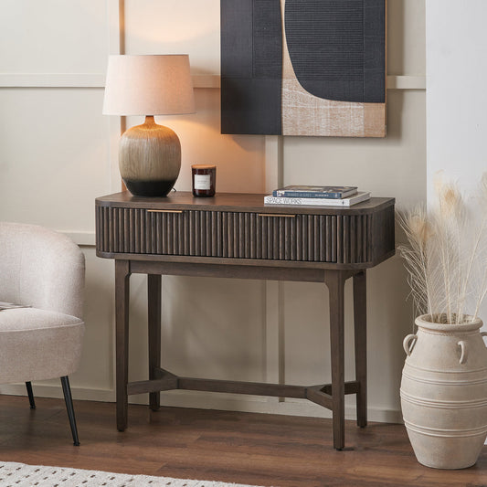 Raie dark brown ribbed console table styled in a contemporary interior