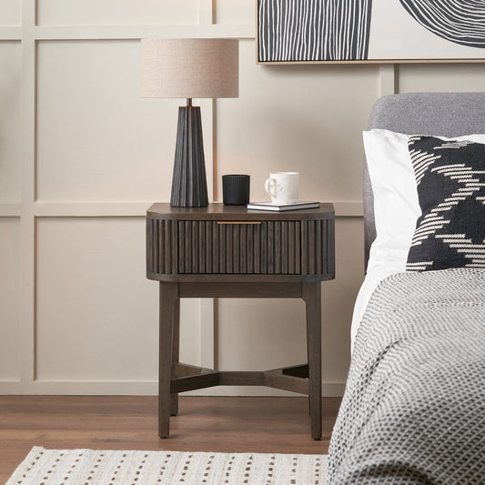 Raie dark brown ribbed one drawer unit styled beside a bed