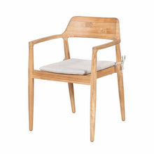 Reuleaux teak outdoor dining set in a garden setting
