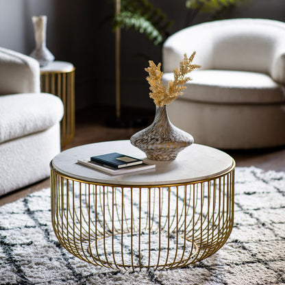 Riley gold coffee table styled in a contemporary living room