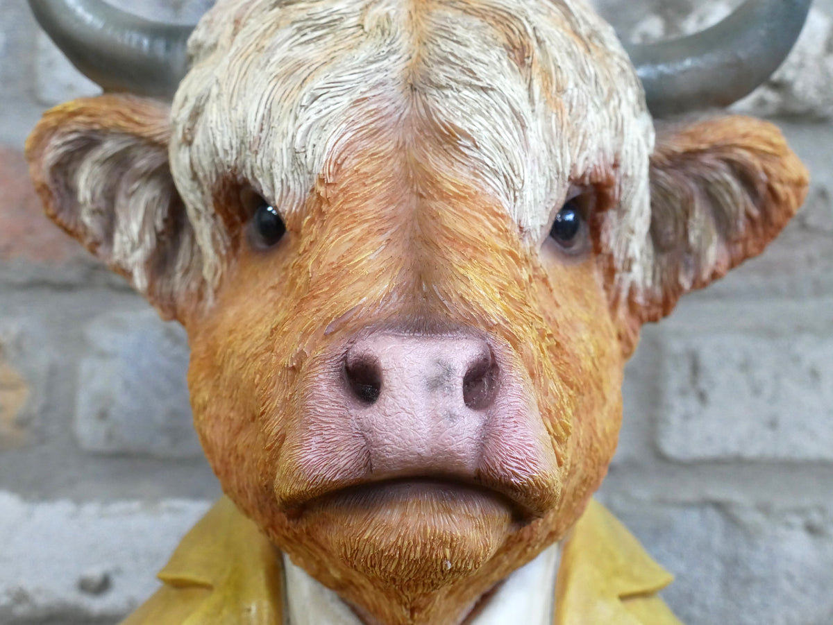 Large cow bust sculpture, face and horn detail