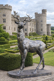Large standing stag statue looking right