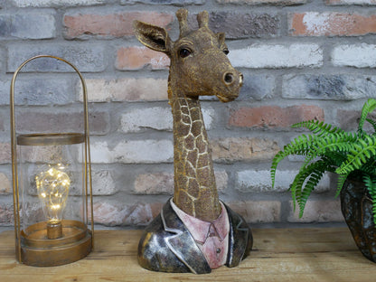 Giraffe bust sculpture displayed on a tabletop