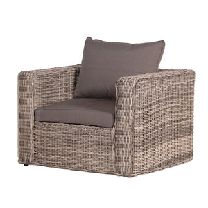 Rattan armchair with cushions